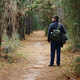 Person on walking path in park